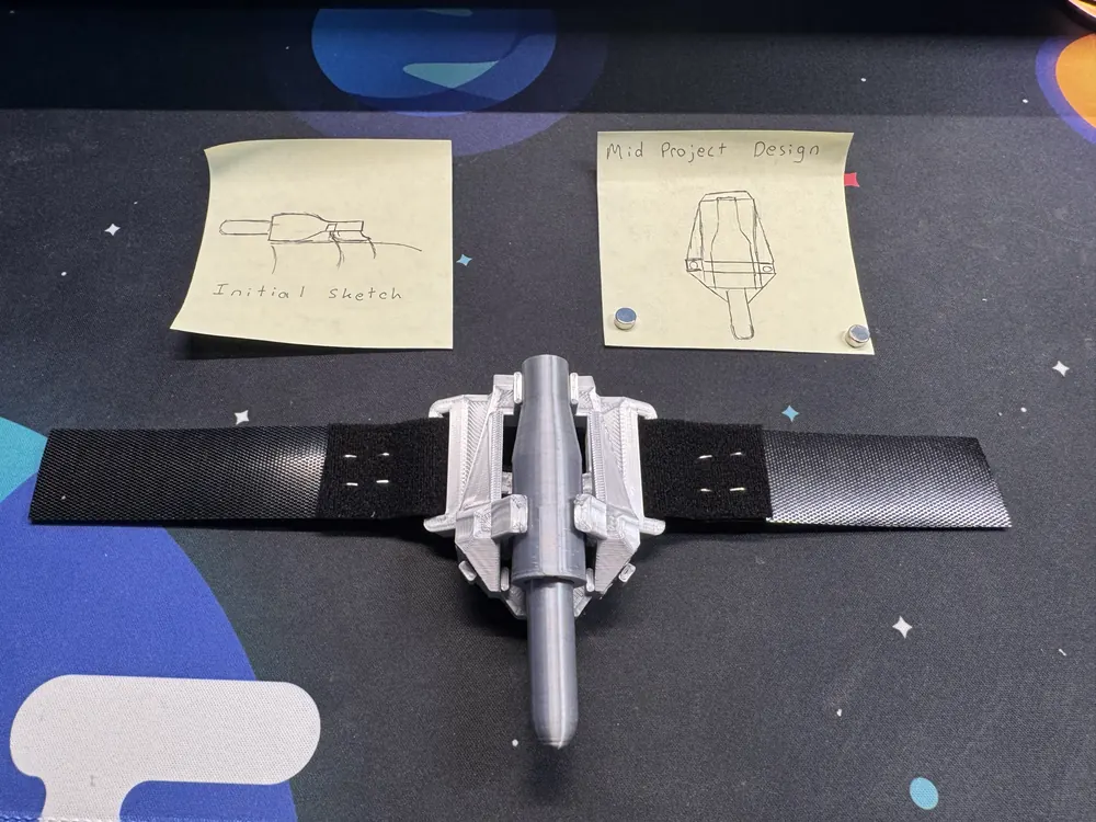 Two sticky notes above the finished webshooter: one labelled Initial sketch, the other Mid Project Design.